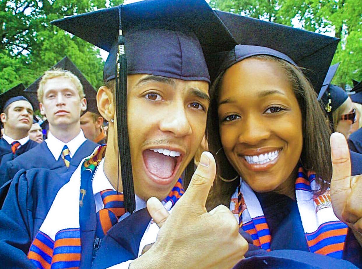 Rogers and Nicole Hyman giving a thumbs up to the camera on graduation day