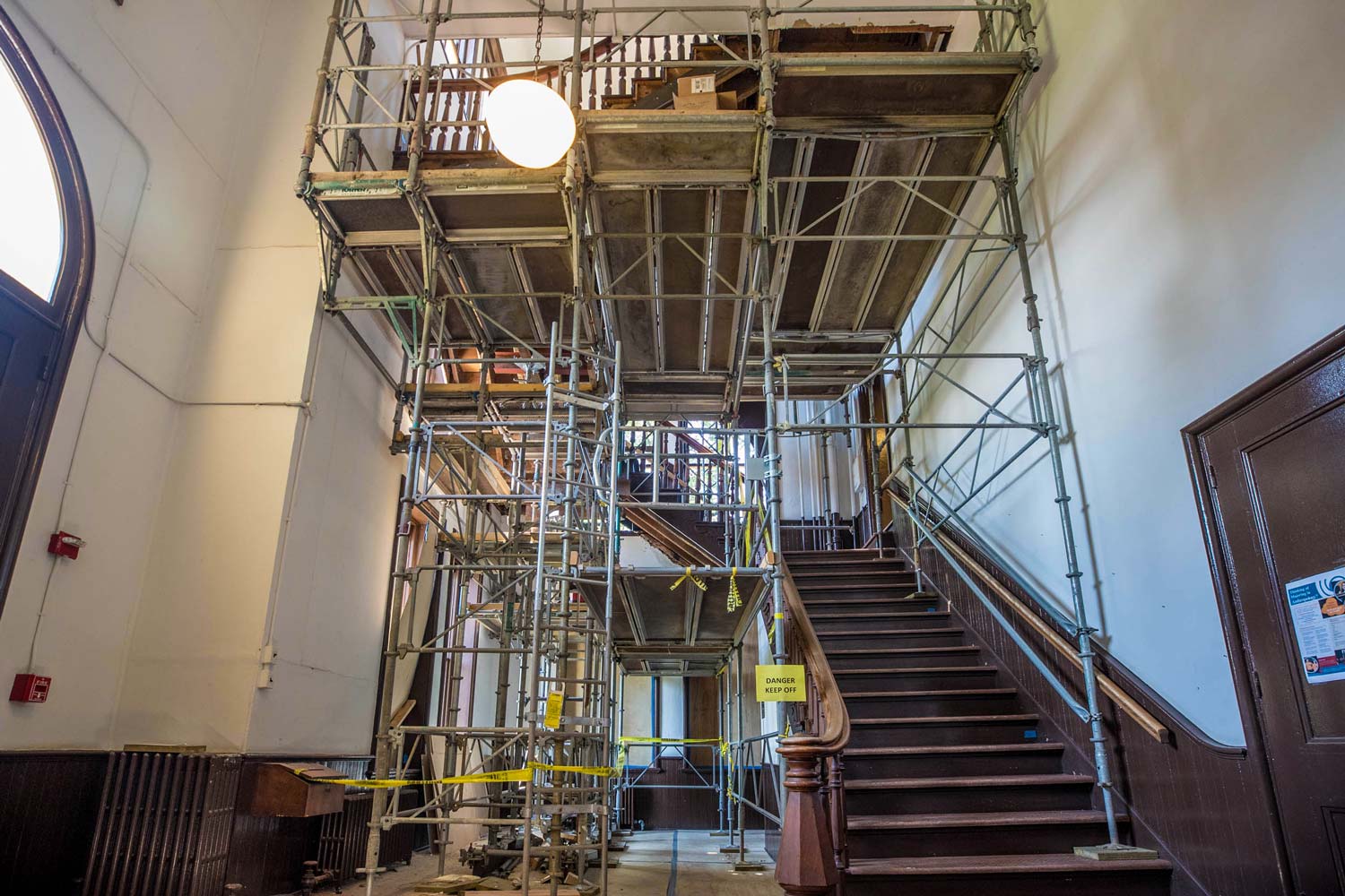 Scaffolding surrounds an old staircase