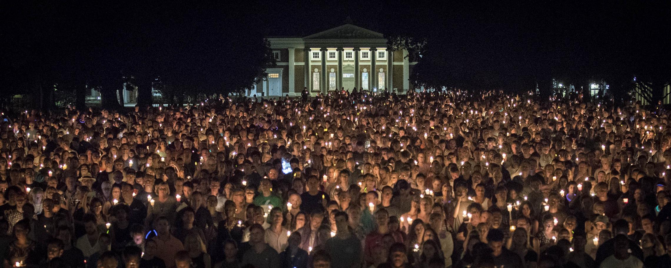Thousands of people on the Lawn holding candles while attended a vigil