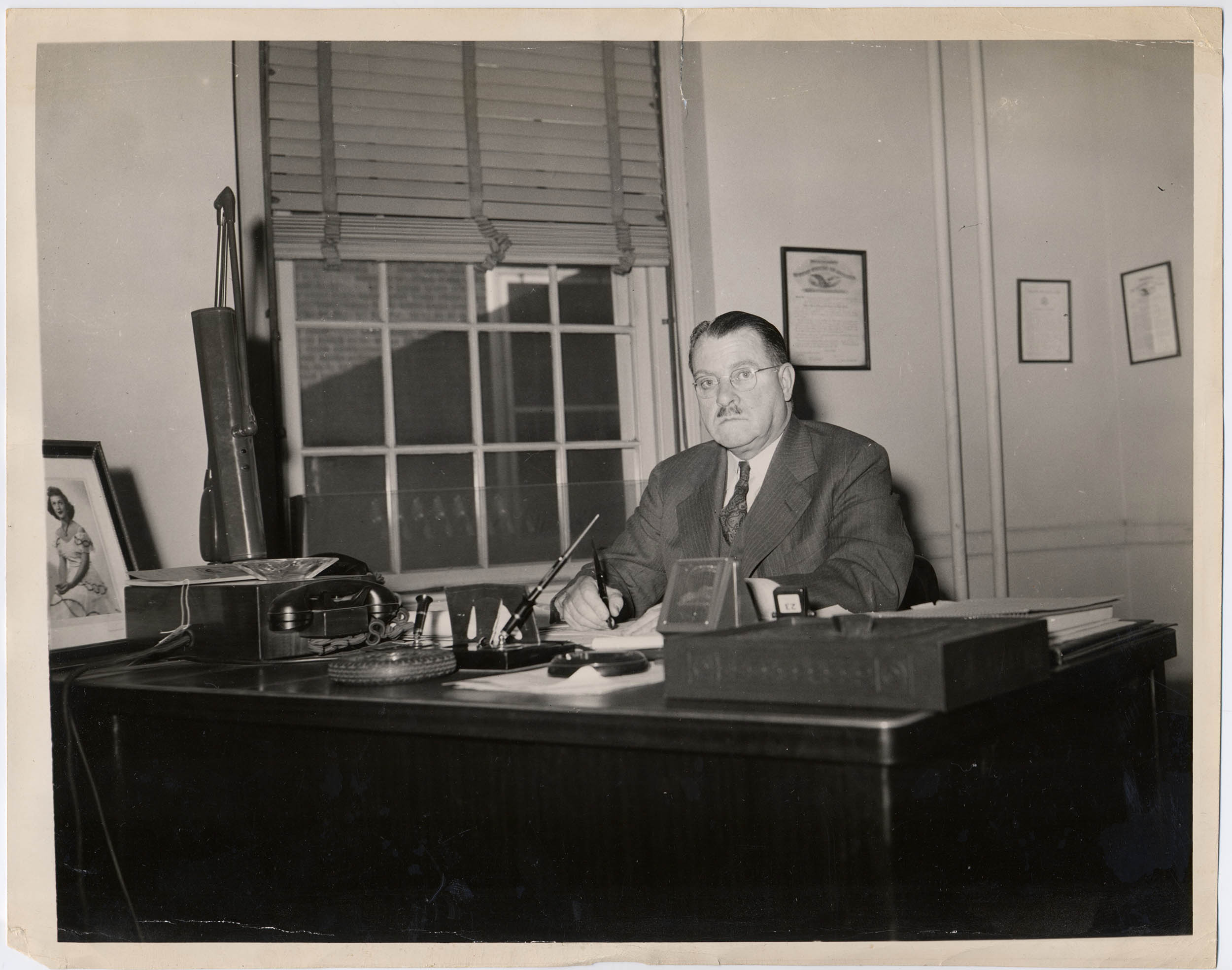 Carlisle Lentz sitting at a desk writing