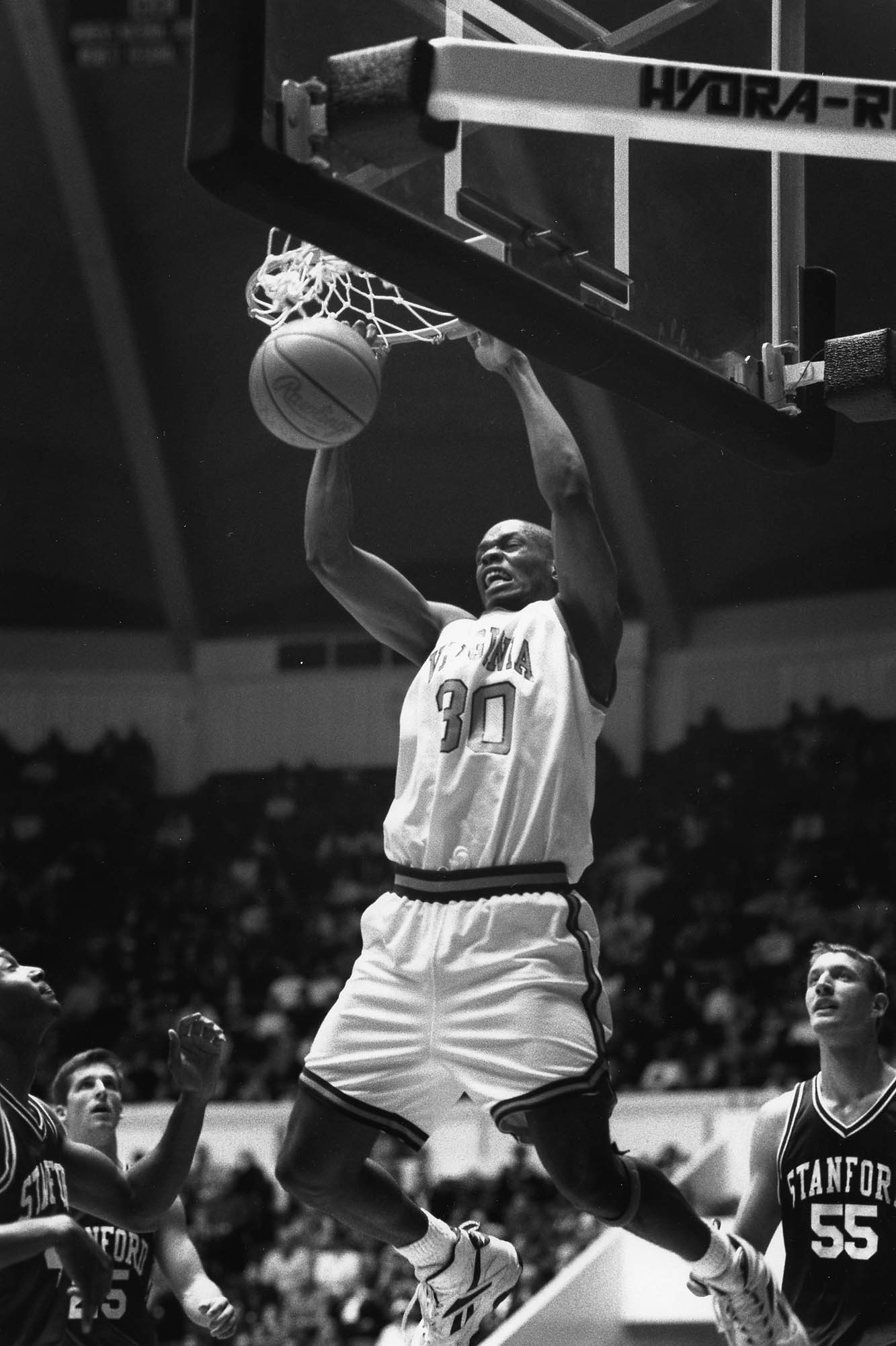 Black and white photo of Jason Williford making a shot during the game