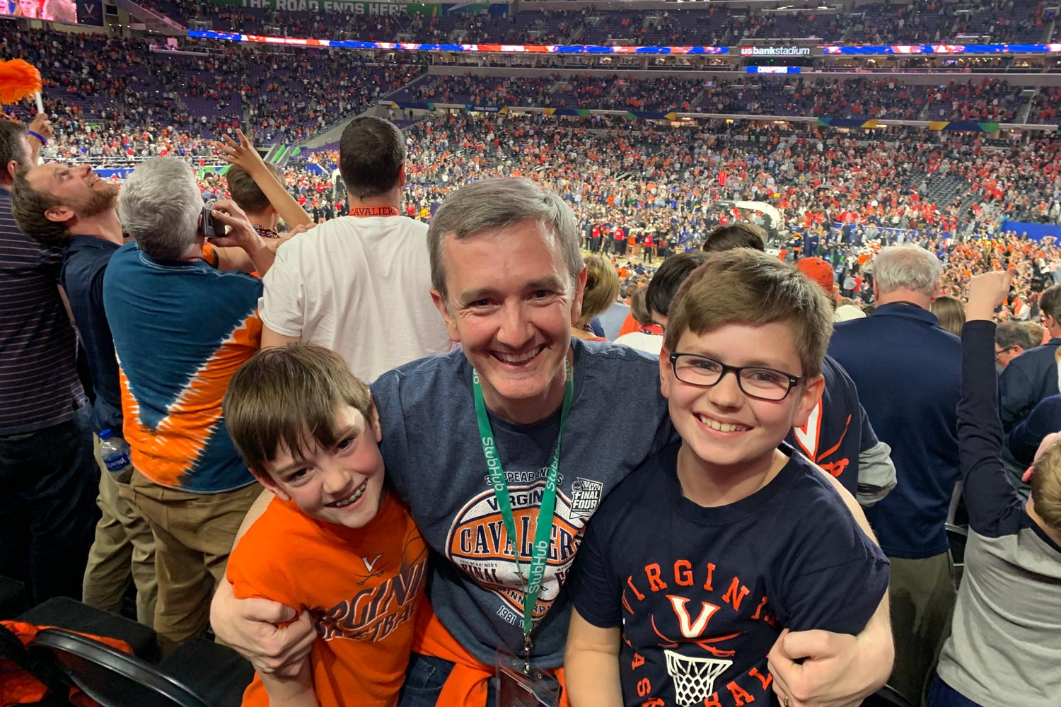  Chris Duffy, center, and his sons James and Henry pose for photo at the Final Four basketball game