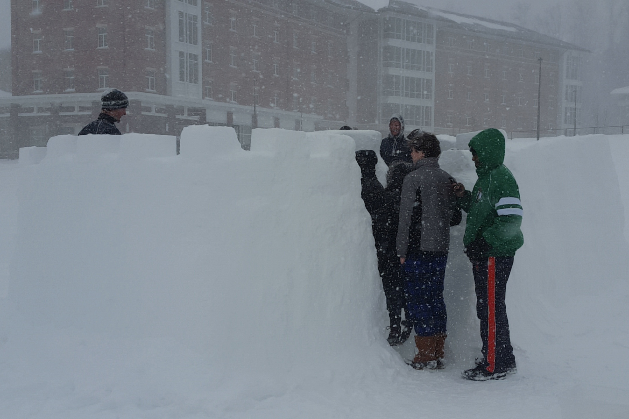 Students building a snow fort