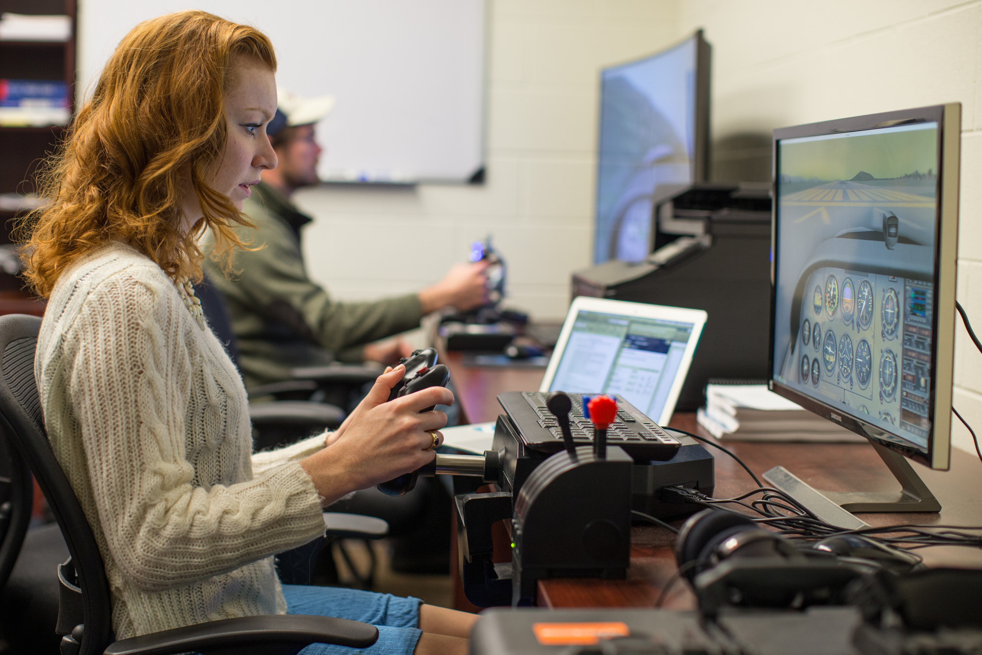 Haley Kosheff uses a computer-based flight simulator.