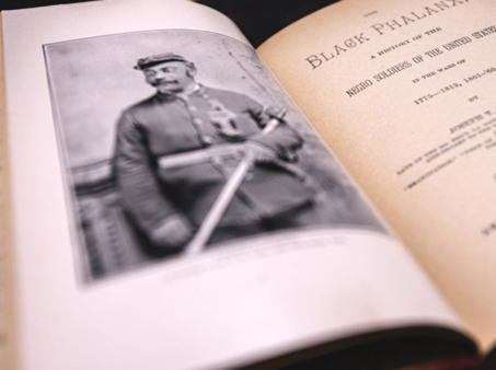Book opened with a picture of a black soldier