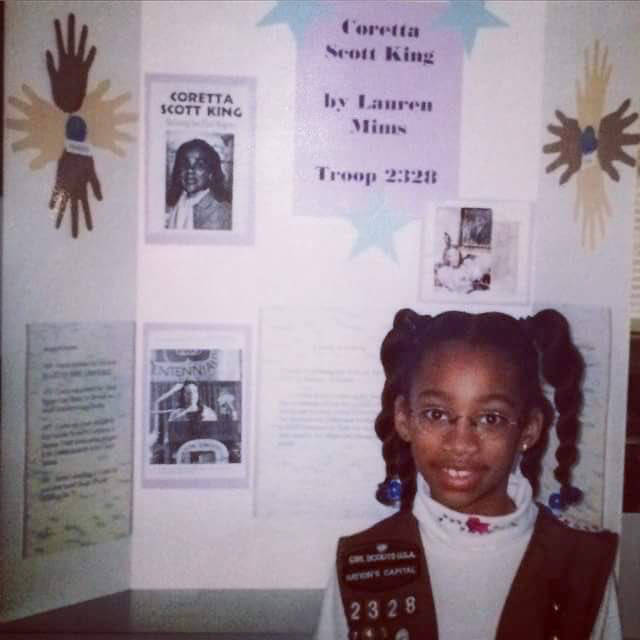 Old image Lauren Mims standing in front of a tri fold project for Girl Scout troop 2328
