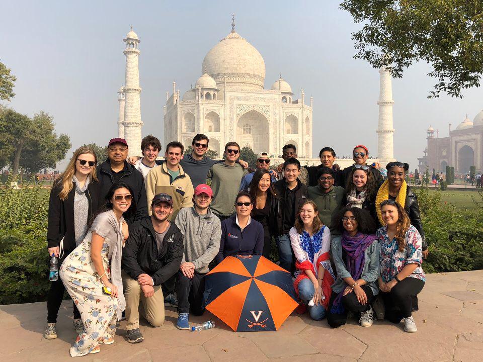 Students pose for a group photo in front of the Taj Mahal 