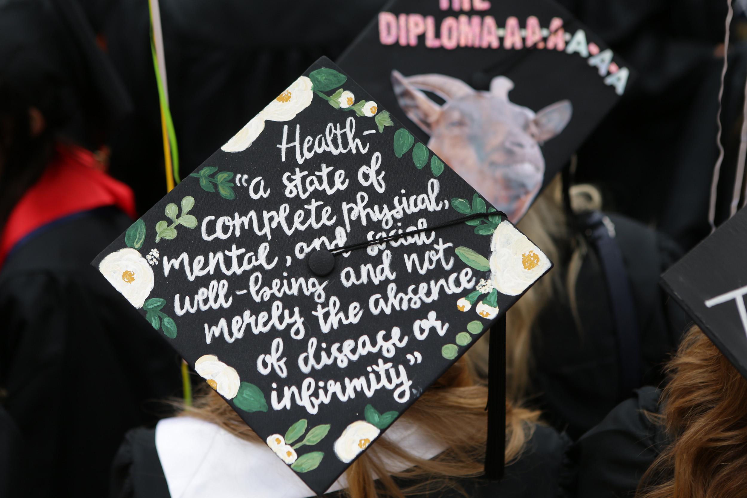 Graduation cap reads: Health- a state of complete physical, mental, and social well-being and not merely the absence of disease or infirmity