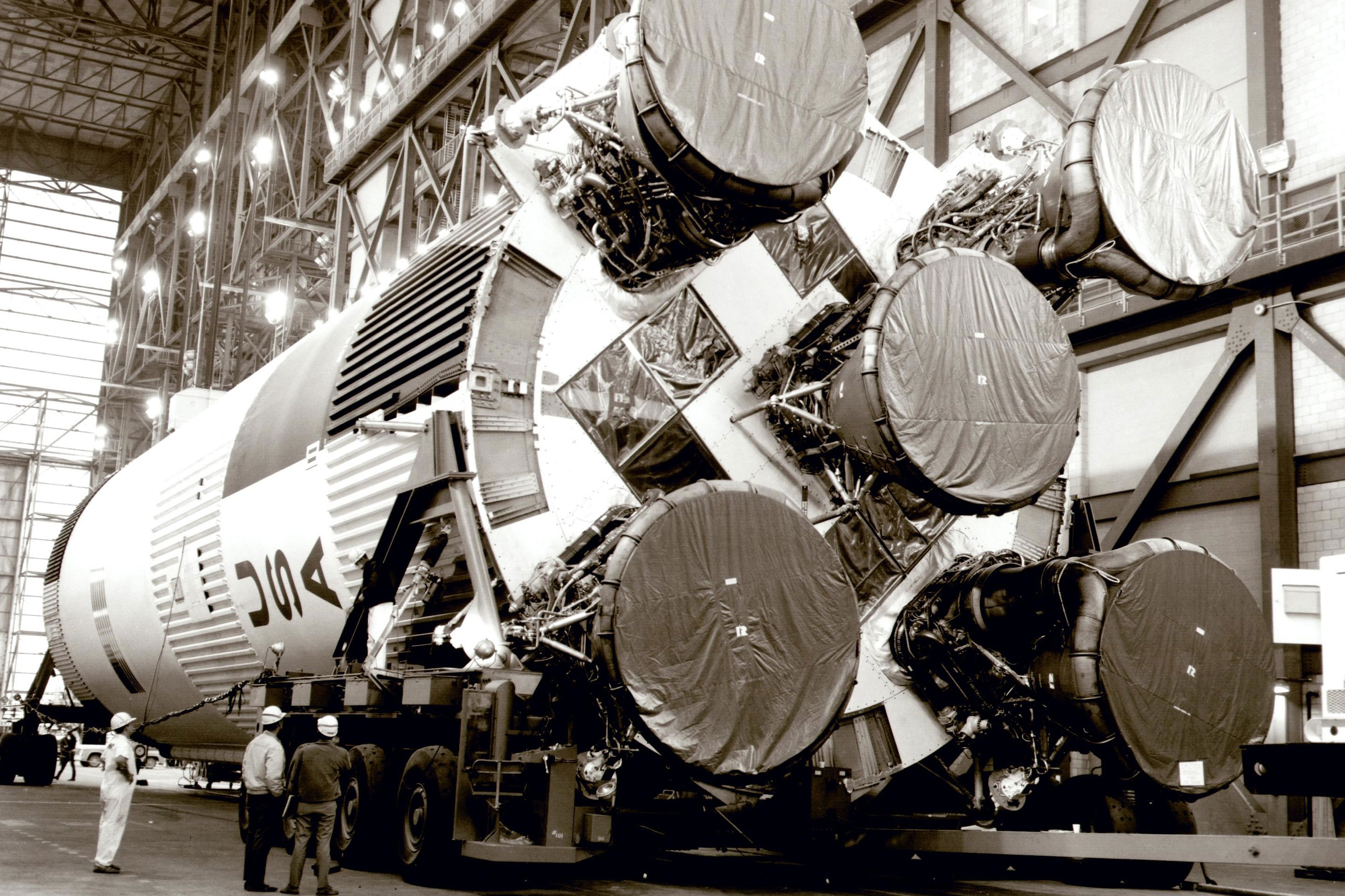 The Saturn V rocket is lifted onto its mobile launcher in the Vehicle Assembly Building at Kennedy Space Center in 1969. 