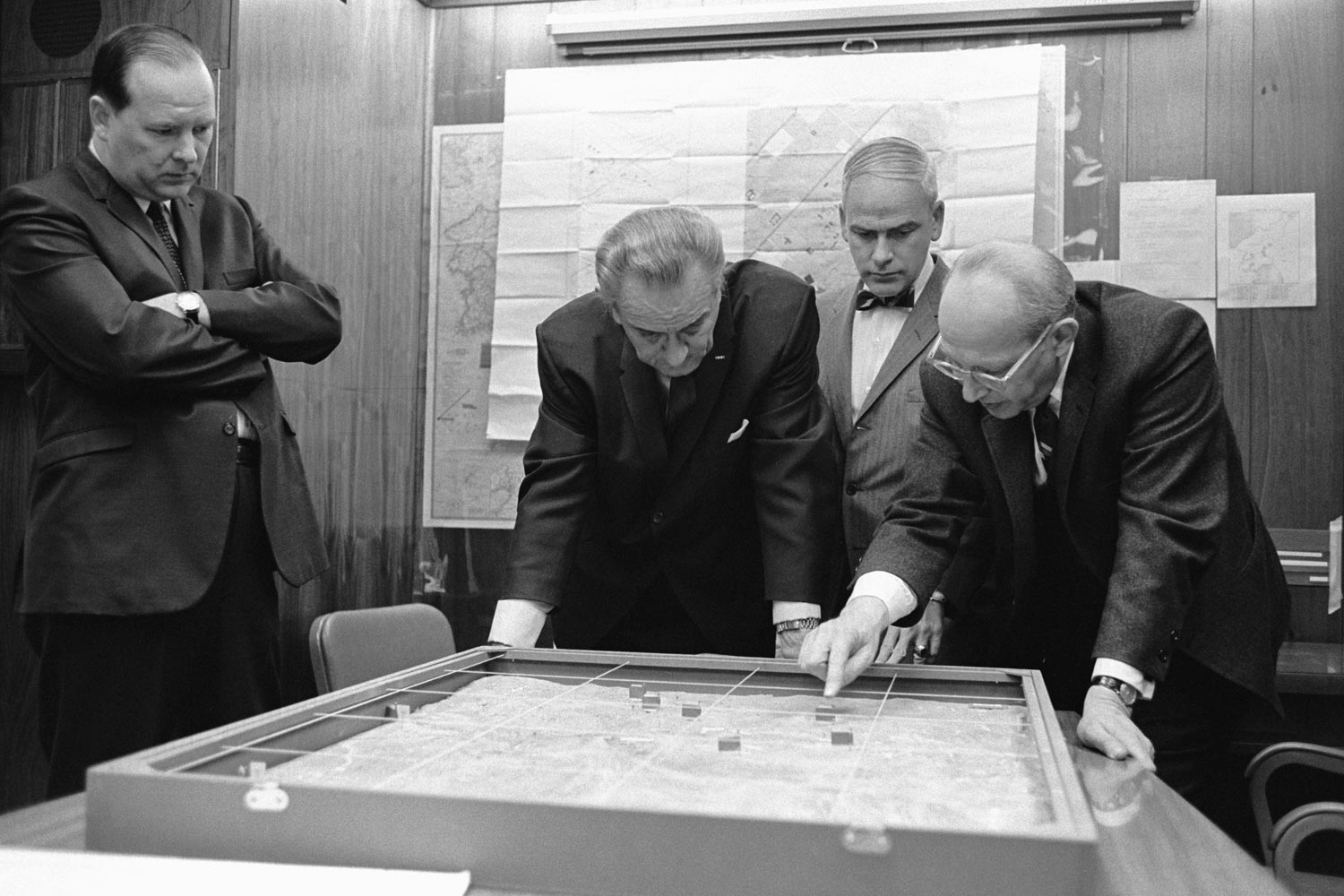 Walt Rostow shows President Lyndon Johnson a model of the Khe Sanh, black and white image