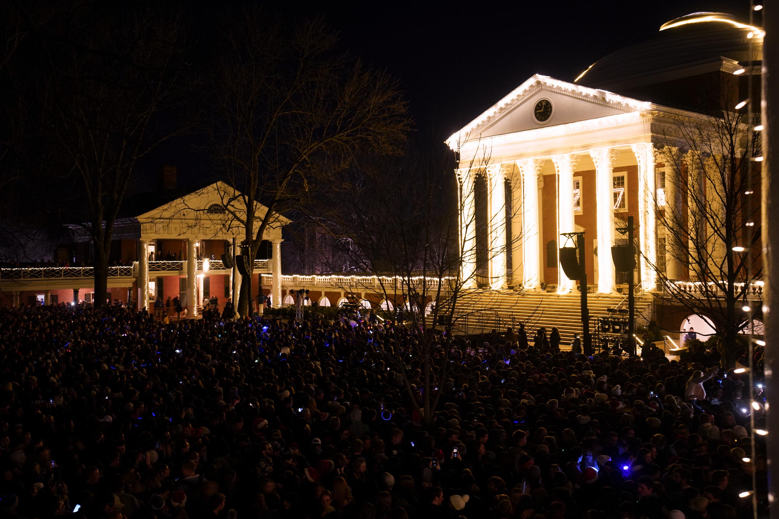 View of the lawn filled with people lit up in multiple colors