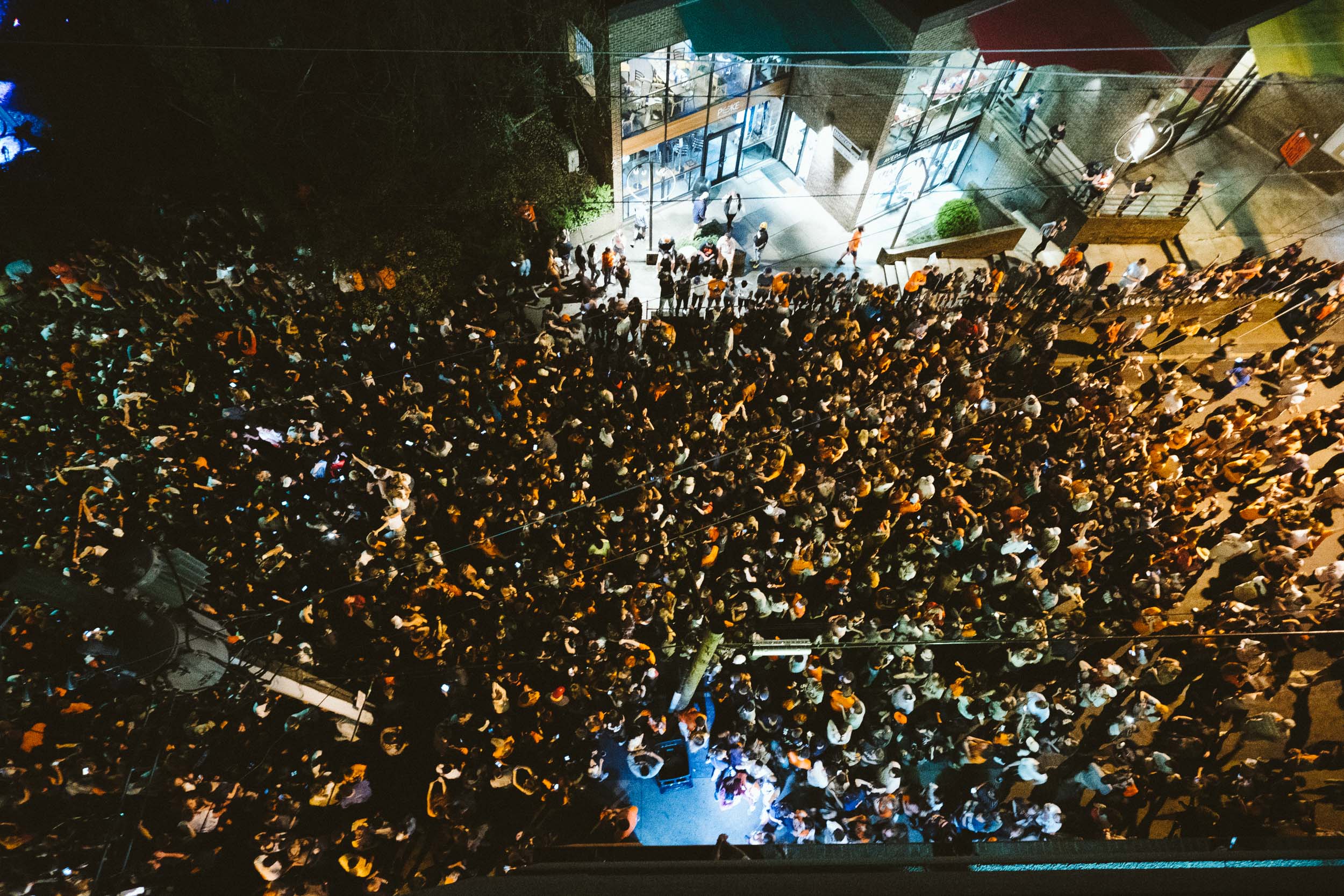 Aerial view of crowd outside of the building celebrating a UVA victory