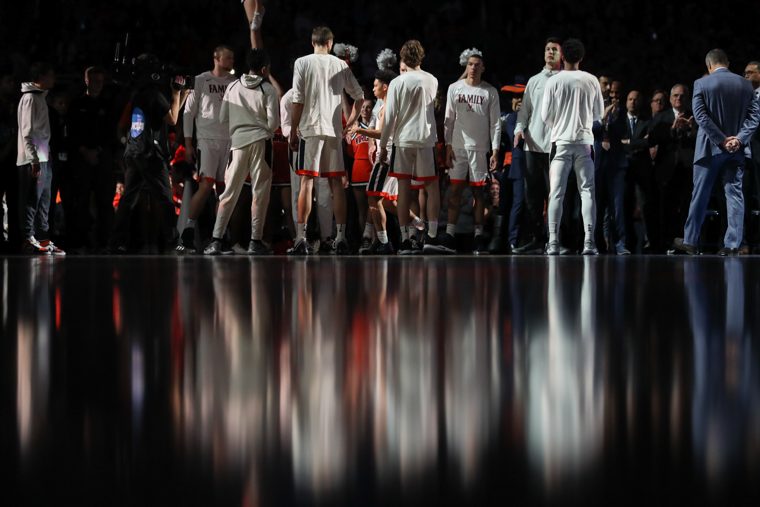 UVA basketball players standing together