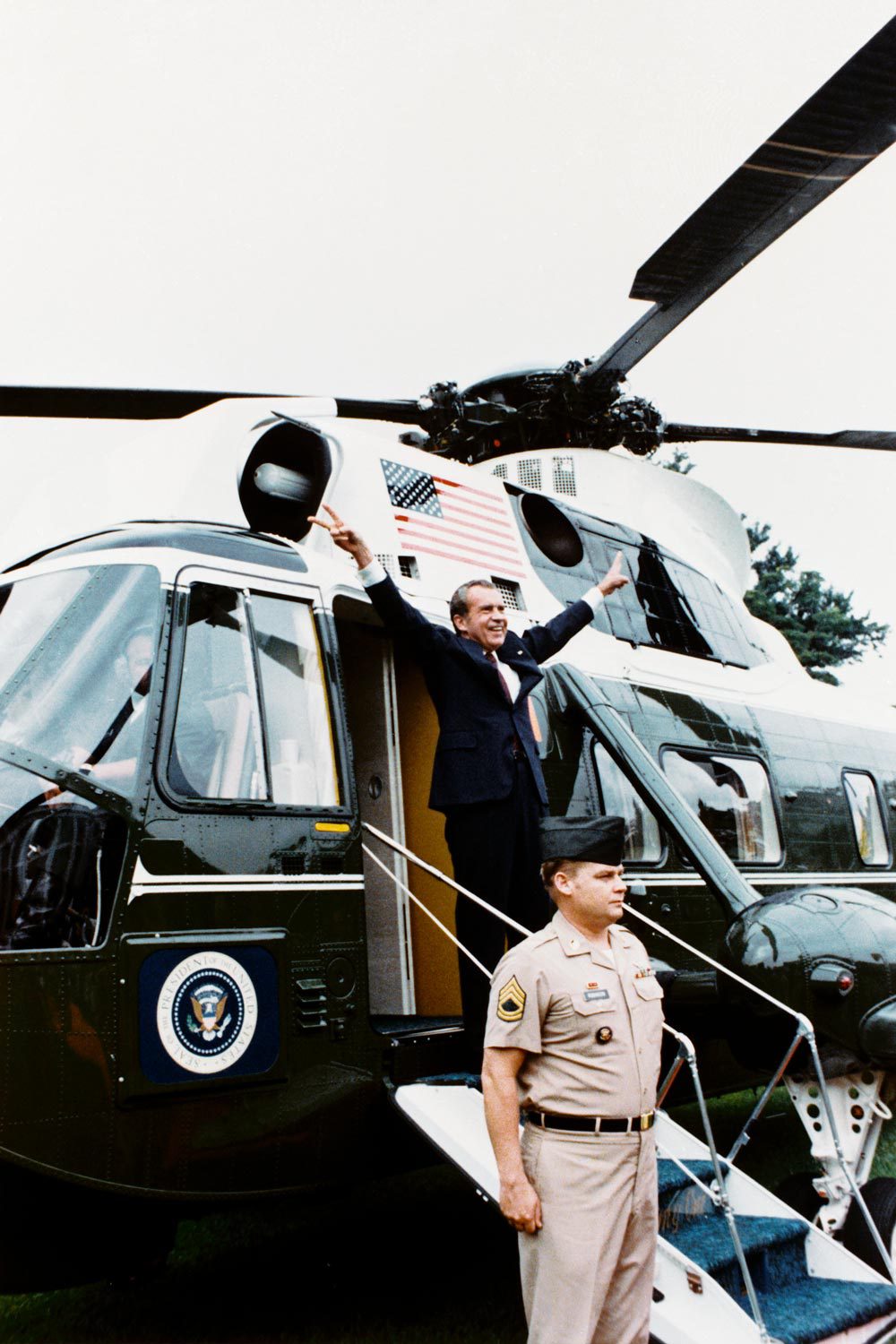 Richard Nixon, pictured waving farewell to staff