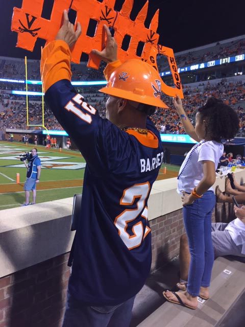 Patasomcit and his 6-year-old grandniece cheering for UVA