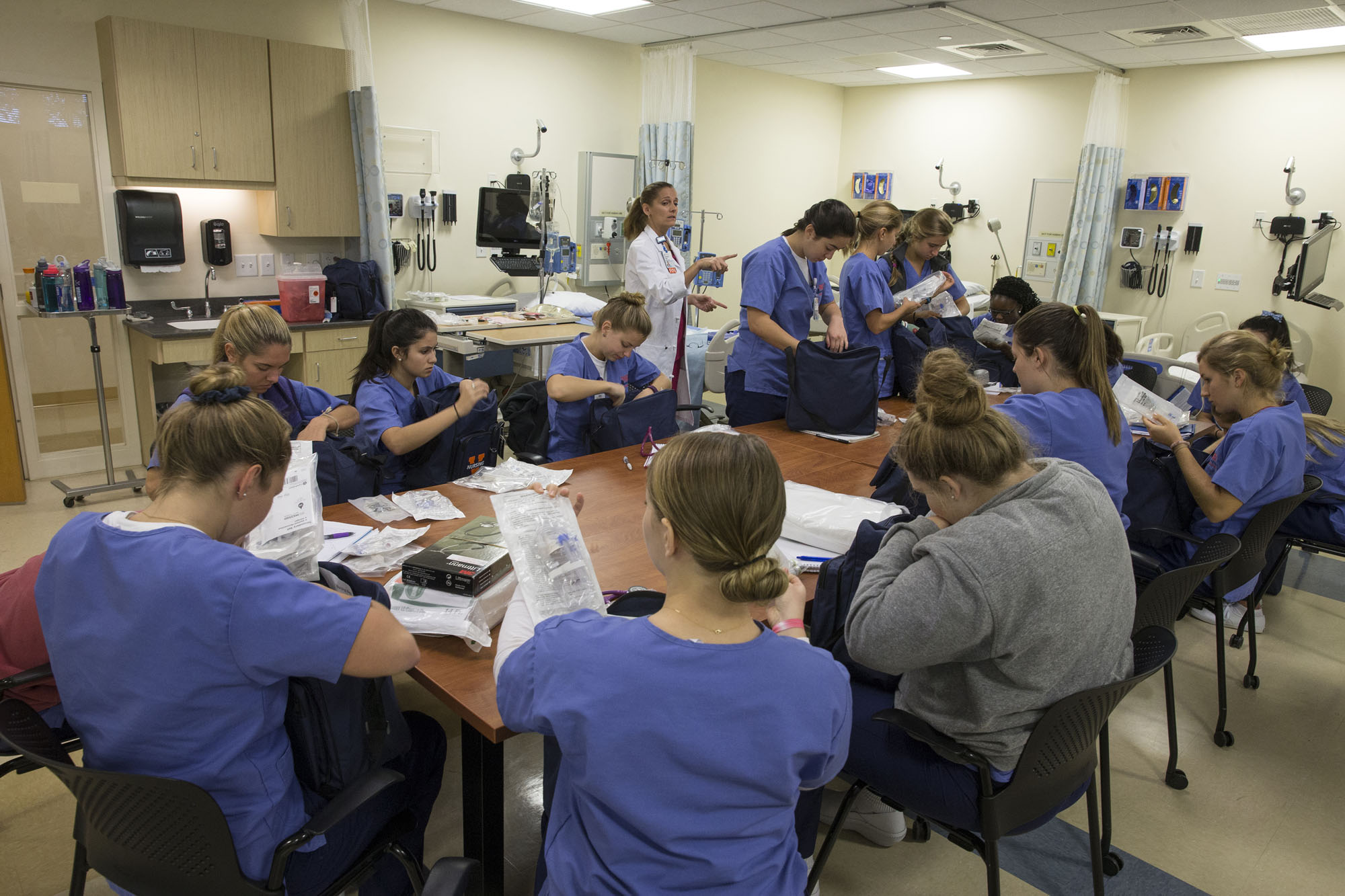 Second year nursing students in Professor Kathy Haugh’s and Brook Lemieux’s Health Assessment class practice examining one another’s ears, eyes, noses and throats in the Mary Morton Parsons Clinical Simulation Learning Center.