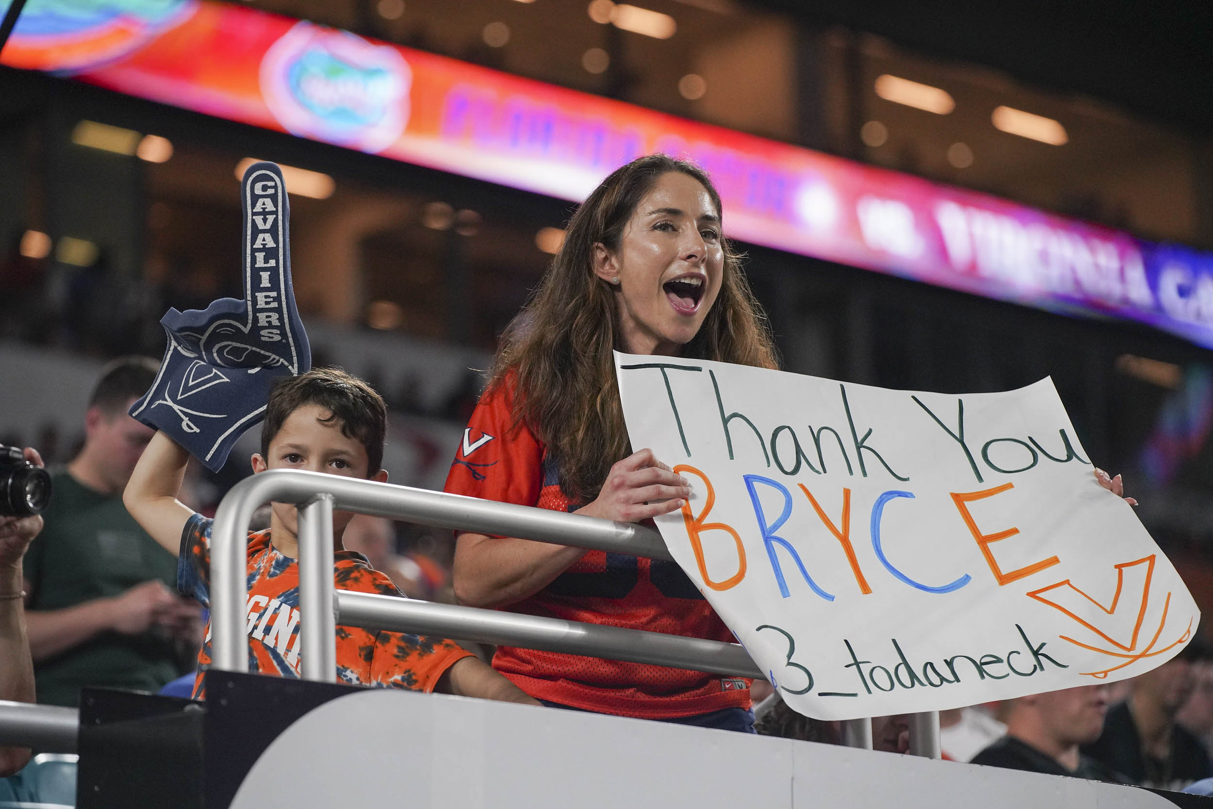 UVA Fan holding a sign that reads Thank you Bryce