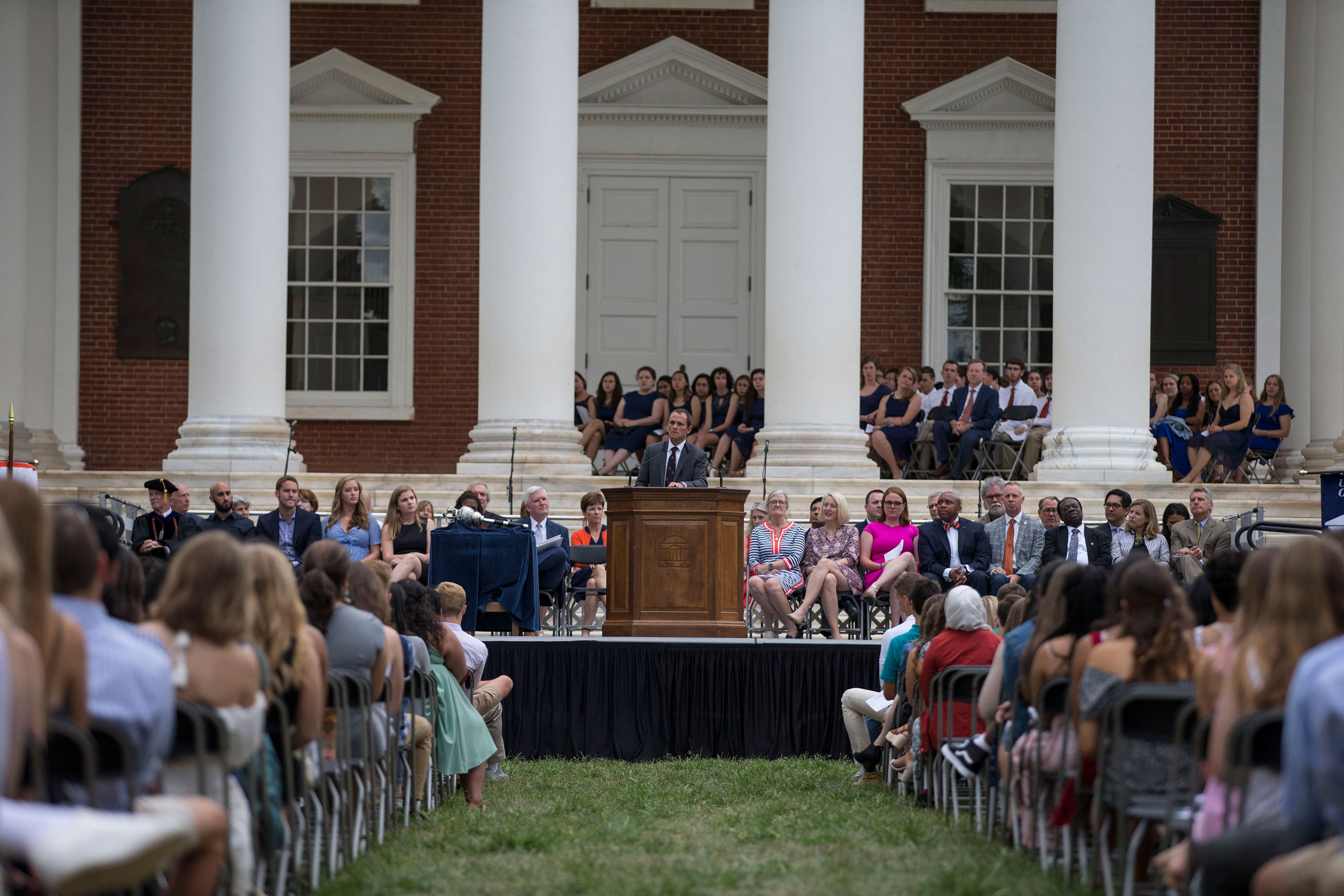 Jim Ryan speaking to the class of 2023 on the Lawn from a podium