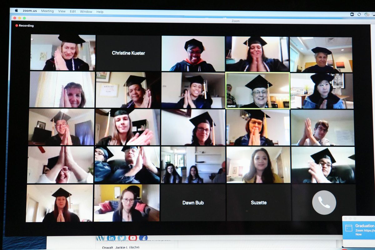Zoom graduation session with attendees clapping