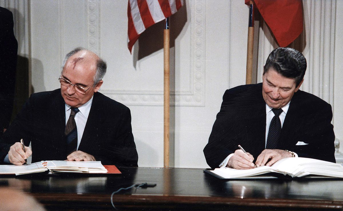 President Reagan and Soviet General Secretary Gorbachev signing a treaty
