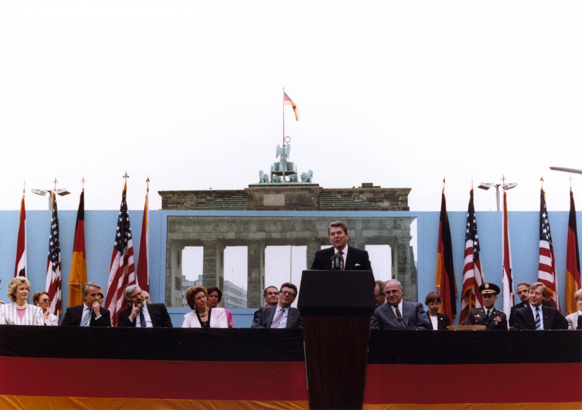 President Reagan giving a speech at a podium