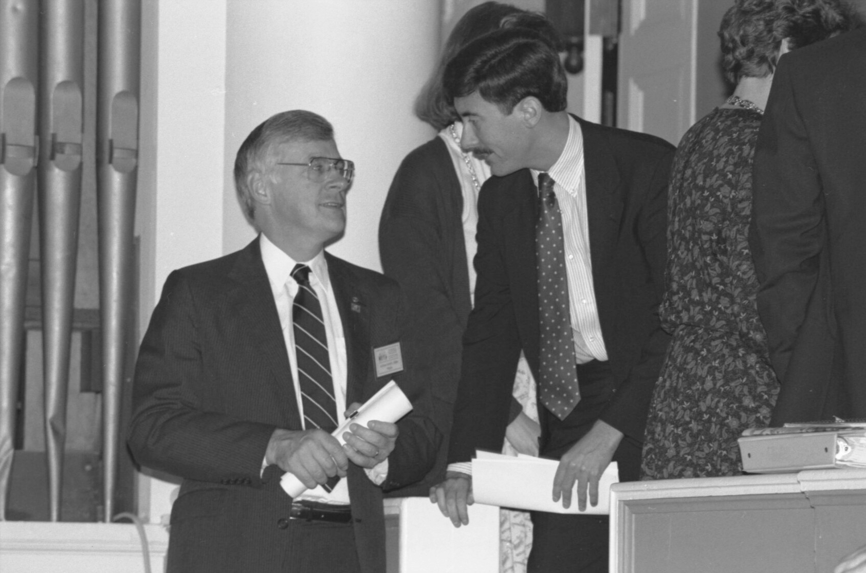 Black and White image of Larry Sabato, right, Gerald Baliles, left talking