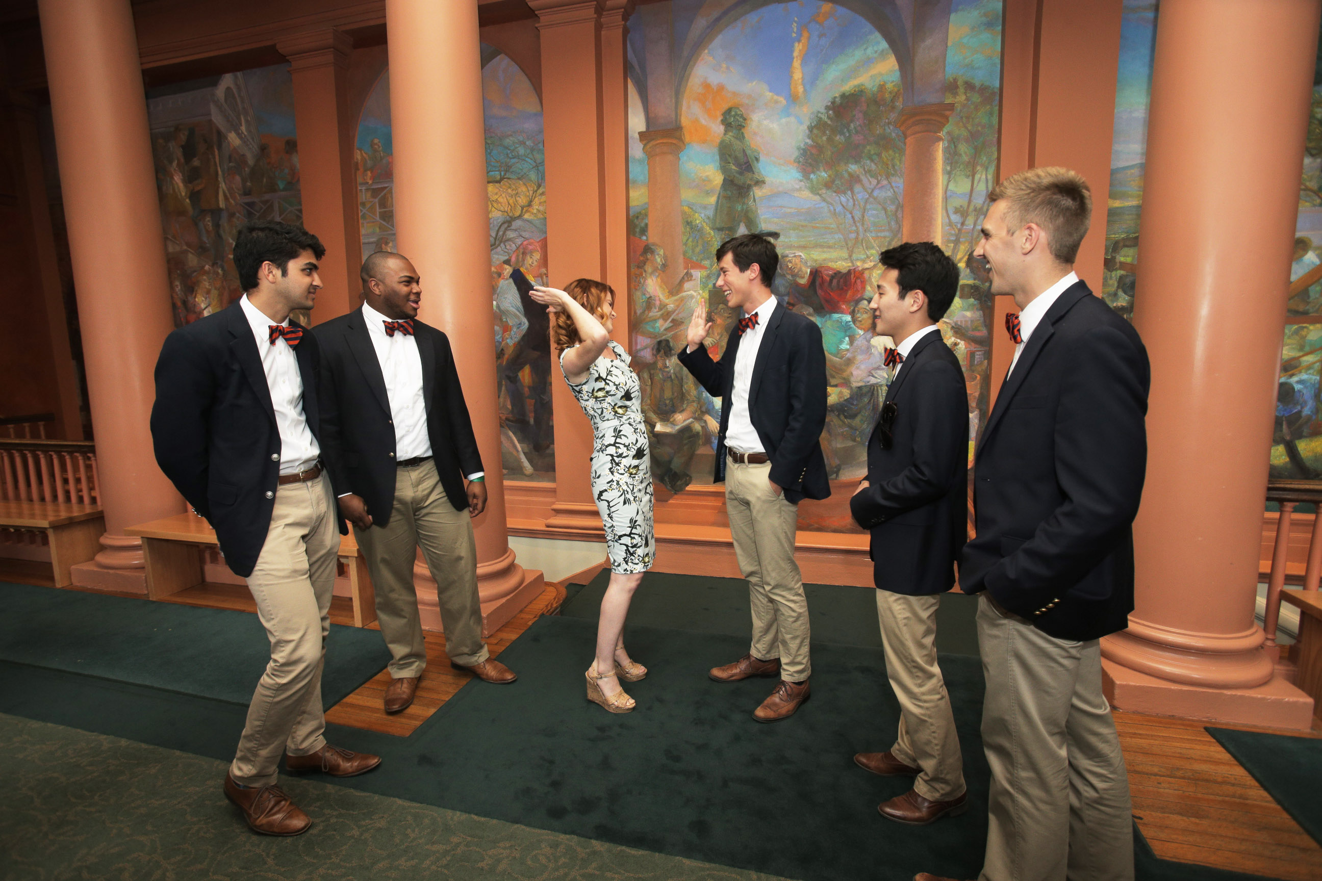 Sarah Drew exchanges a high five with members of the Virginia Gentlemen. (Photos by Sanjay Suchak and Dan Addison)