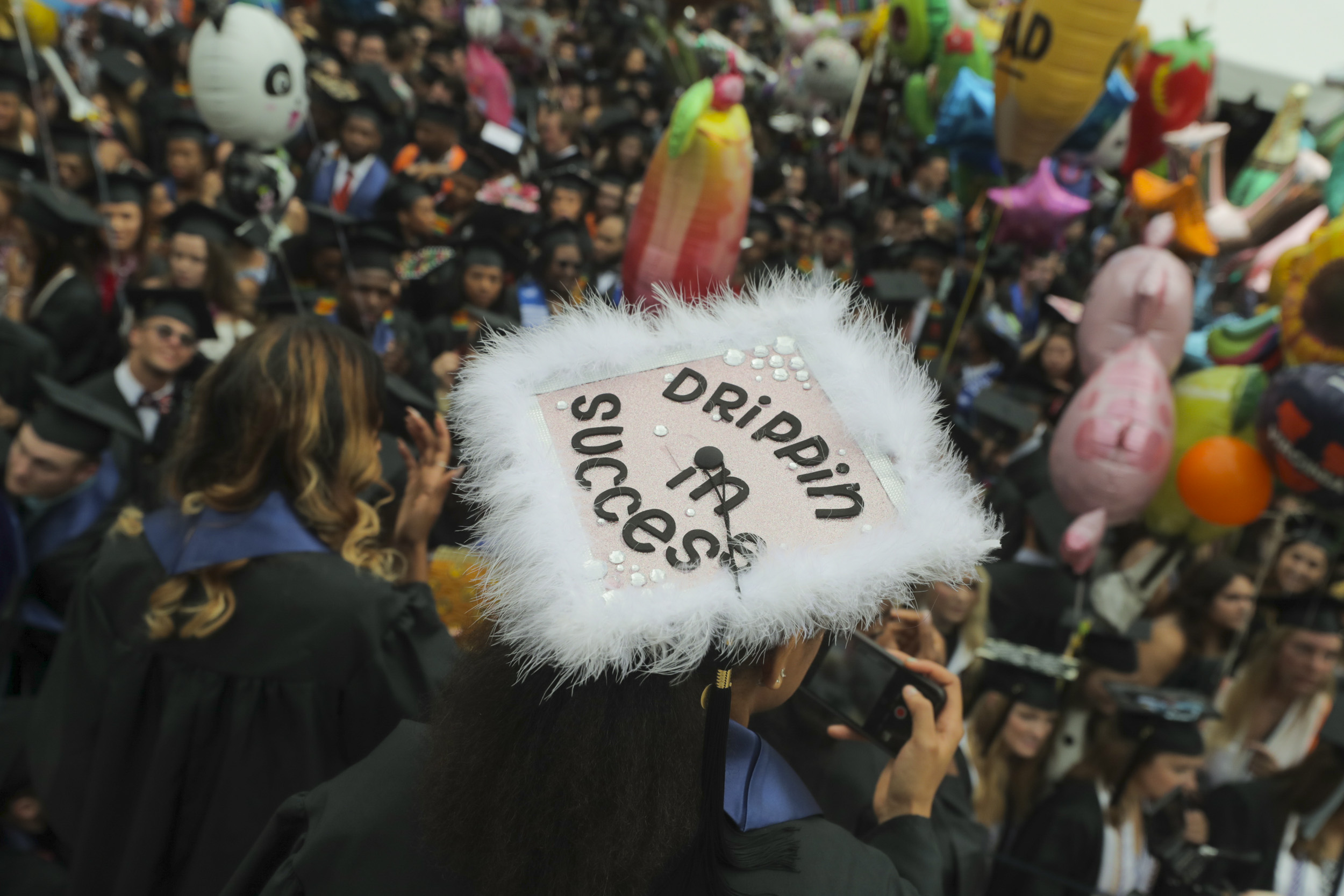 Graduation cap reads: Drippin in success