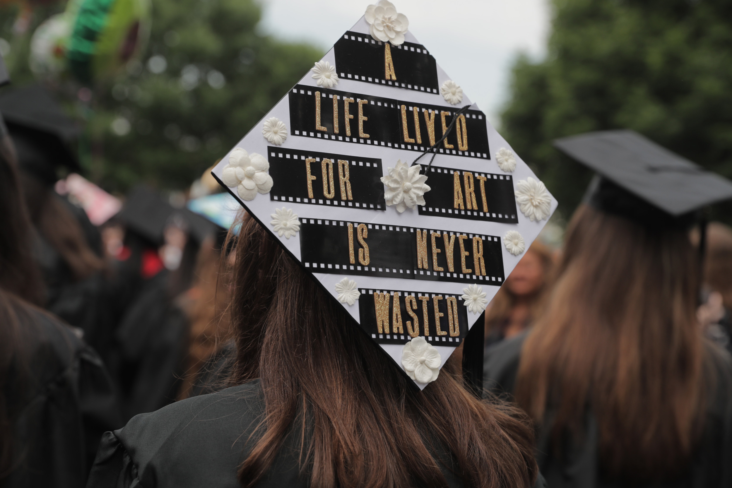 Graduation cap reads: A life lived for art is never wasted