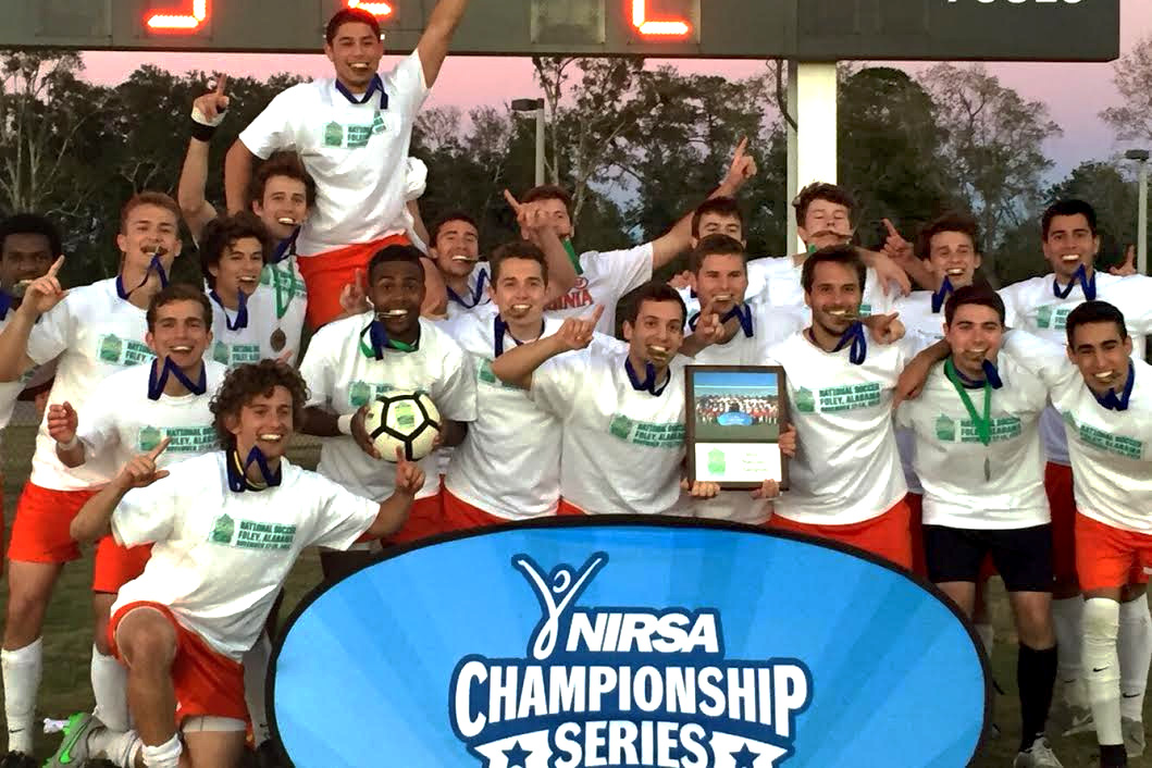 Members of the men’s club soccer team celebrate their win at the NIRSA National Soccer Championships, held in Foley, Alabama. 