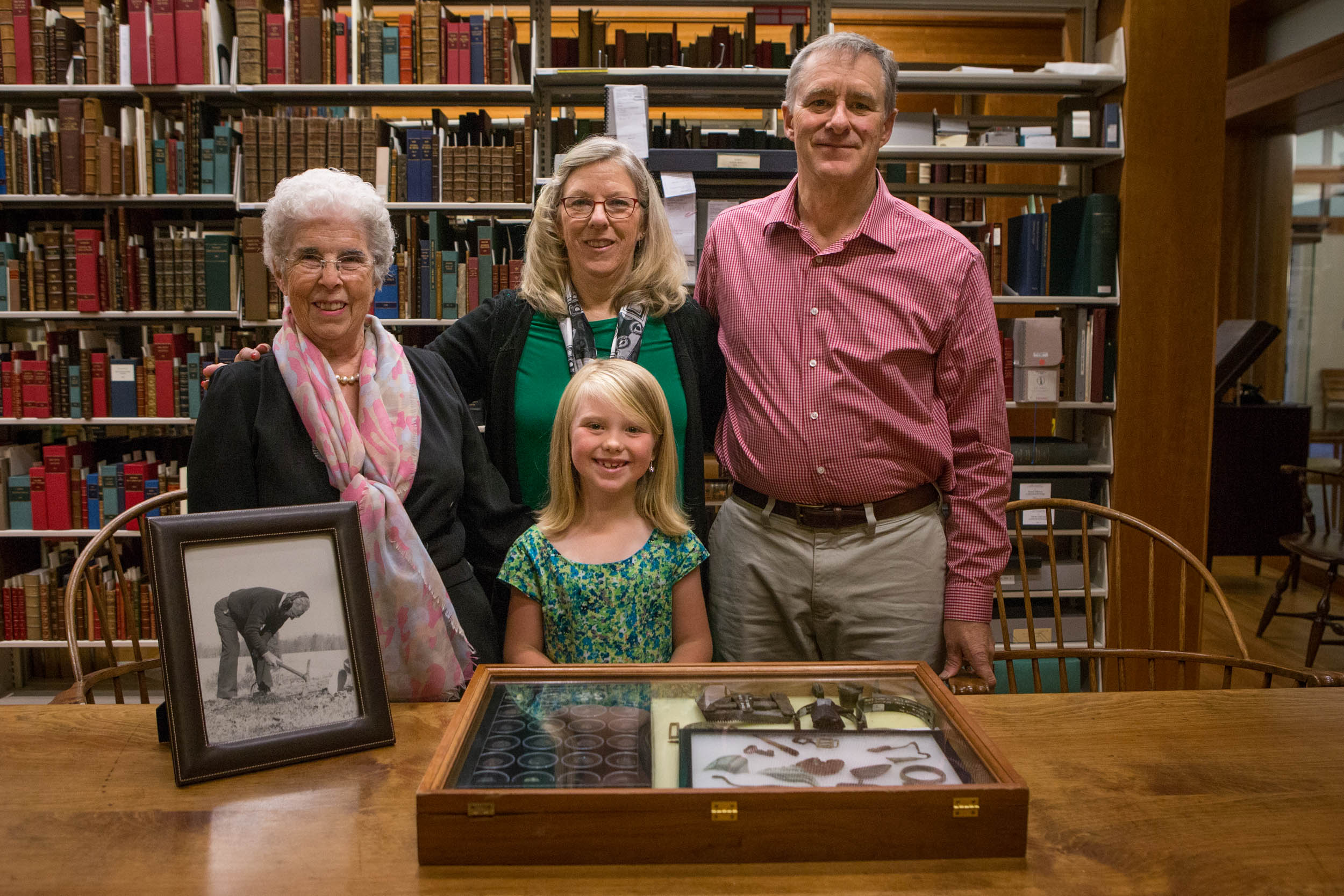 Raymond Shaw’s family displays the donation of his Civil War artifacts. From left to right: Gretta Shaw, Lori Pollard, Morgan Shaw (center), and David Shaw. (Photo by Sanjay Suchak/University Communications)