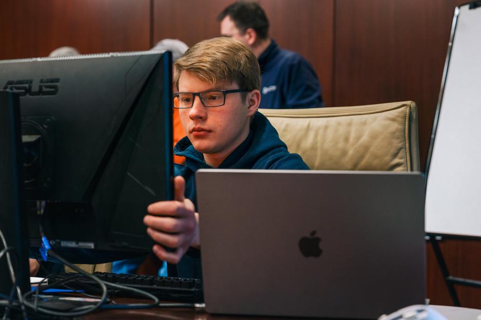 Student observes two monitors