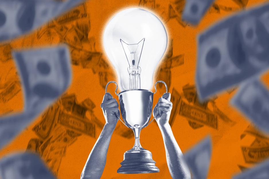 A lightbulb in a trophy surrounded by $100 bills 