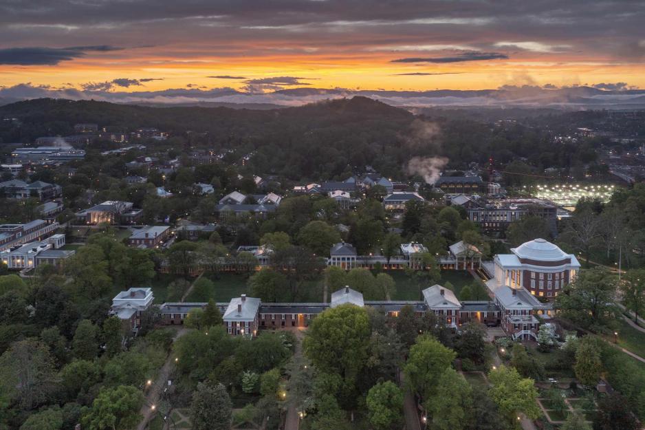 An aerial view of the Lawn and Rotunda during a beautiful orange and purple sunset