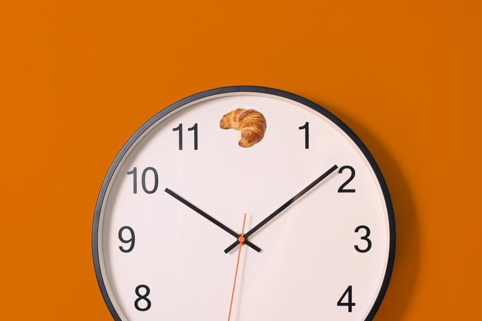 Clock with a pastry at noon