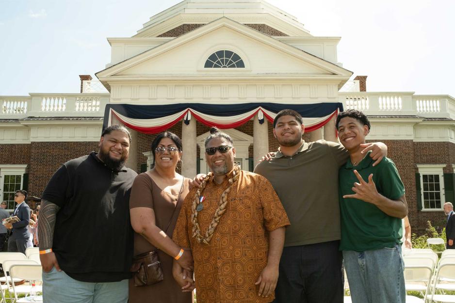 Sui Amaama, center, and his family, wife Isabelle, sons Snoop, Dogg and Slim standing in front of Monticello at the end of the naturalization ceremony.