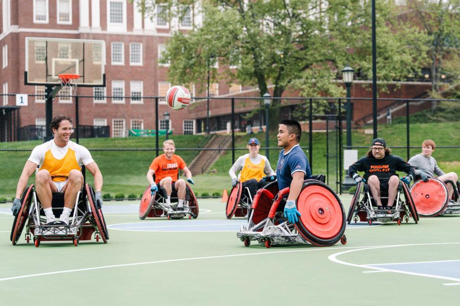Individuals with disabilities playing wheelchair basketball..