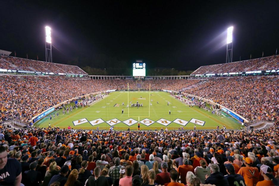 Stands full during a UVA Football game at night