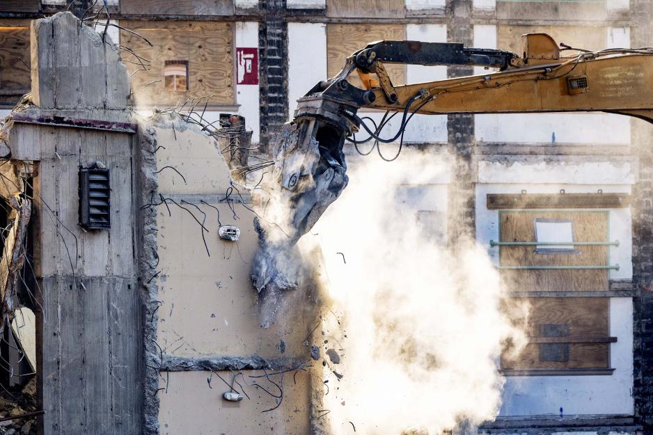 Construction equipment destroying a piece of the stacks