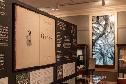 Whitman Exhibit.  Walls filled with text and objects in glass cases