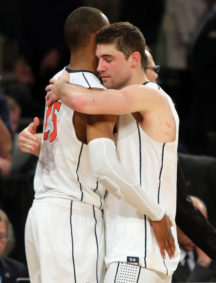 Fourth-year players Akil Mitchell, left, and Joe Harris embrace Friday night in Madison Square Garden. Both helped restore the Cavalier basketball program to national prominence.