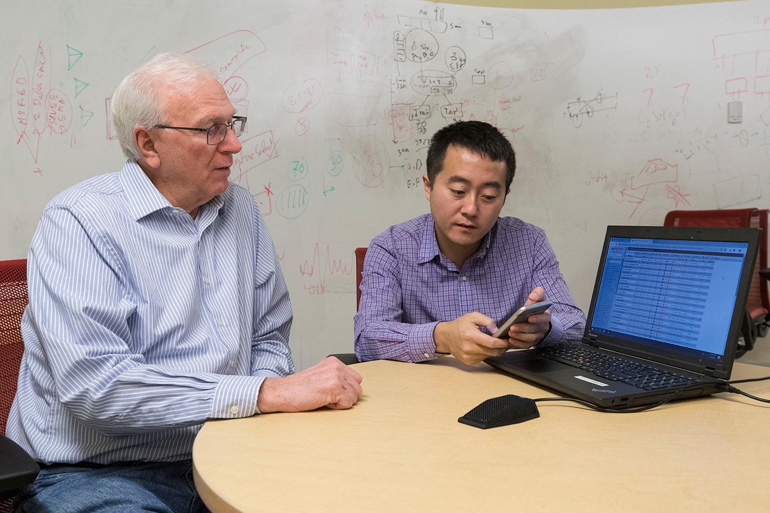 Computer scientists Jack Stankovic, left, and Hongning Wang are developing the system. (Photo by Dan Addison, University Communications) Computer scientists Jack Stankovic, left, and Hongning Wang are developing the system.