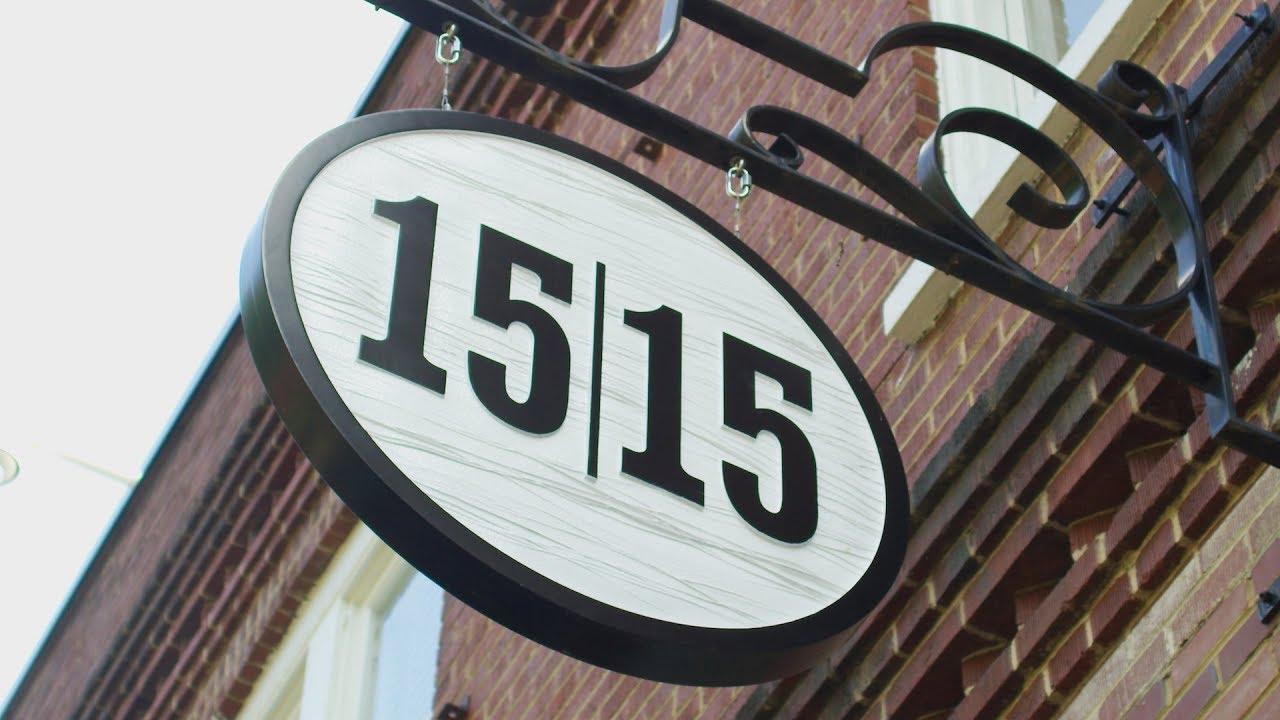 Hanging Business sign that reads 15 | 15