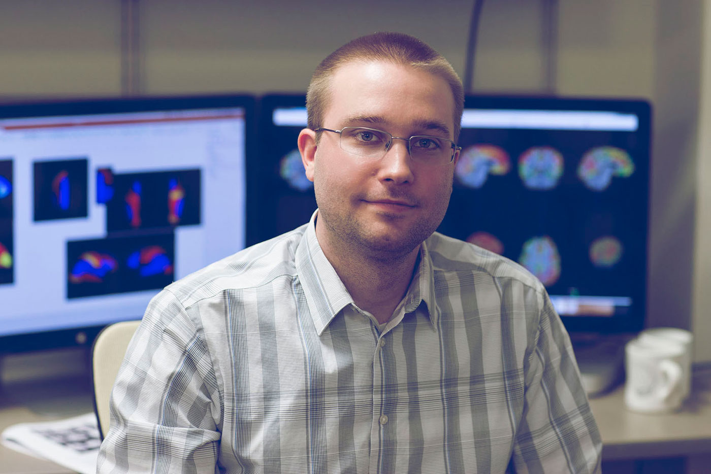 Using fMRI, neuroscience graduate student Bryson Reynolds is studying subconcussions experienced by college football players.