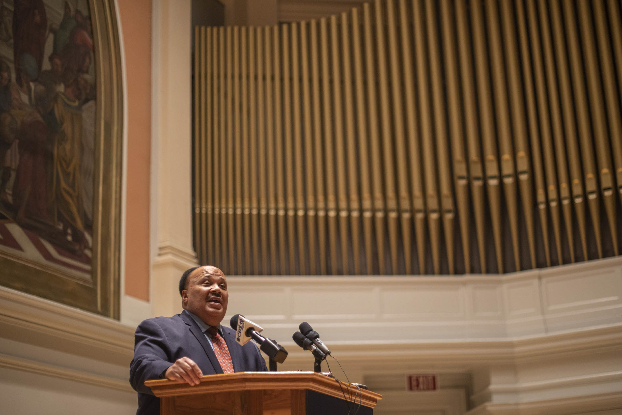 Martin Luther King III speaking at a podium
