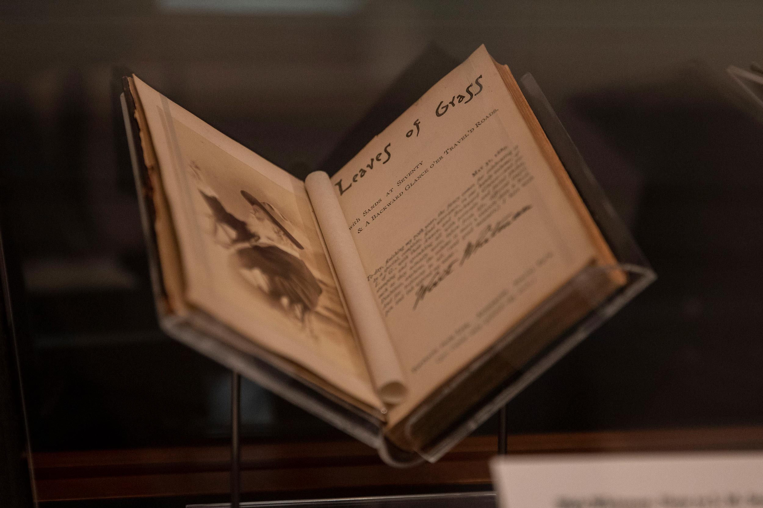 Leaves of Grass copy opened inside of a glass case