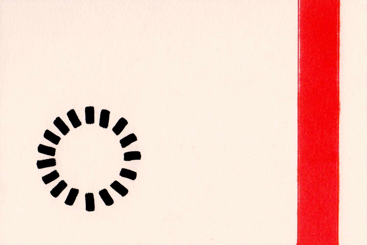 Circle made of black lines, left, and a one inch red line