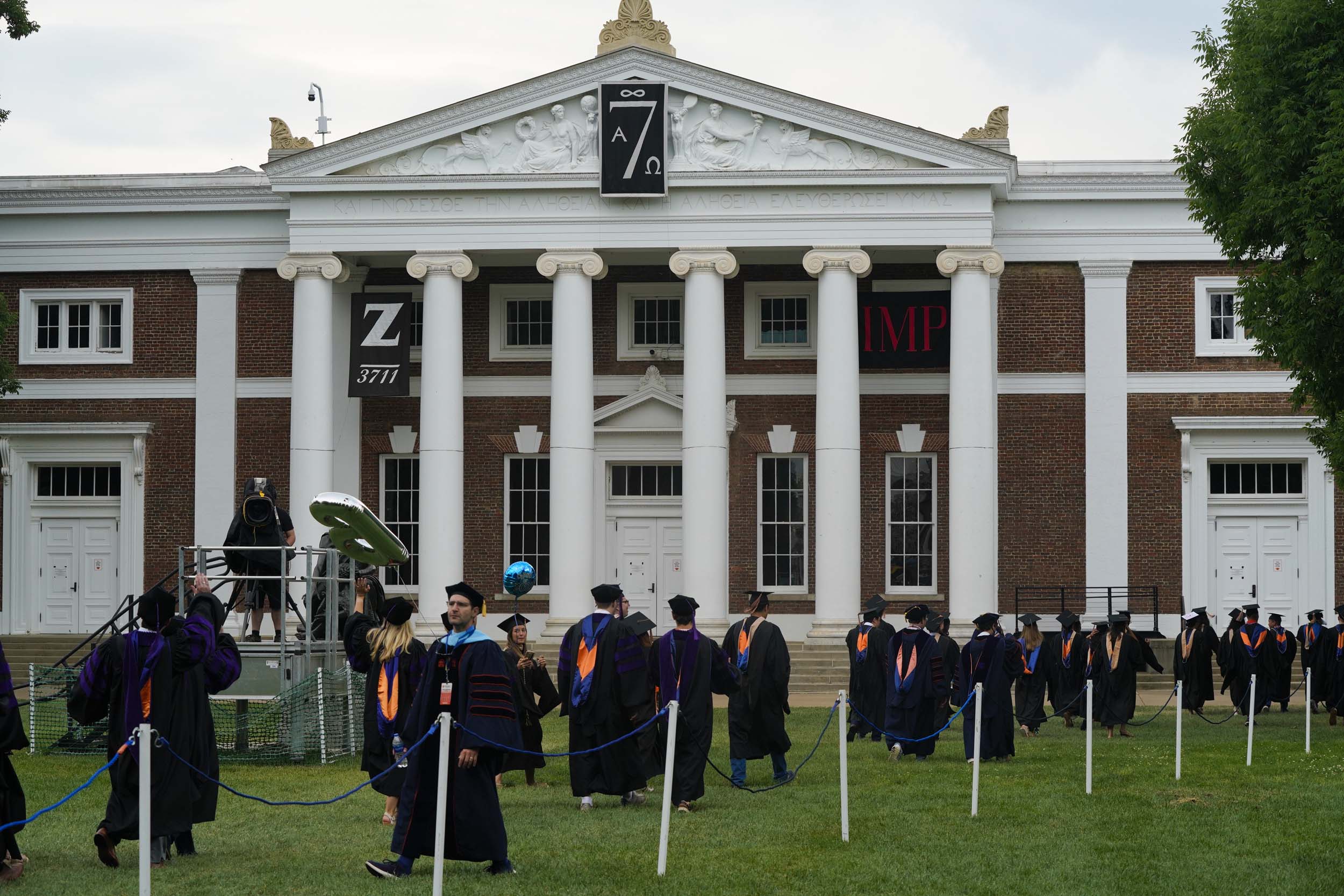 Graduates walking across grounds