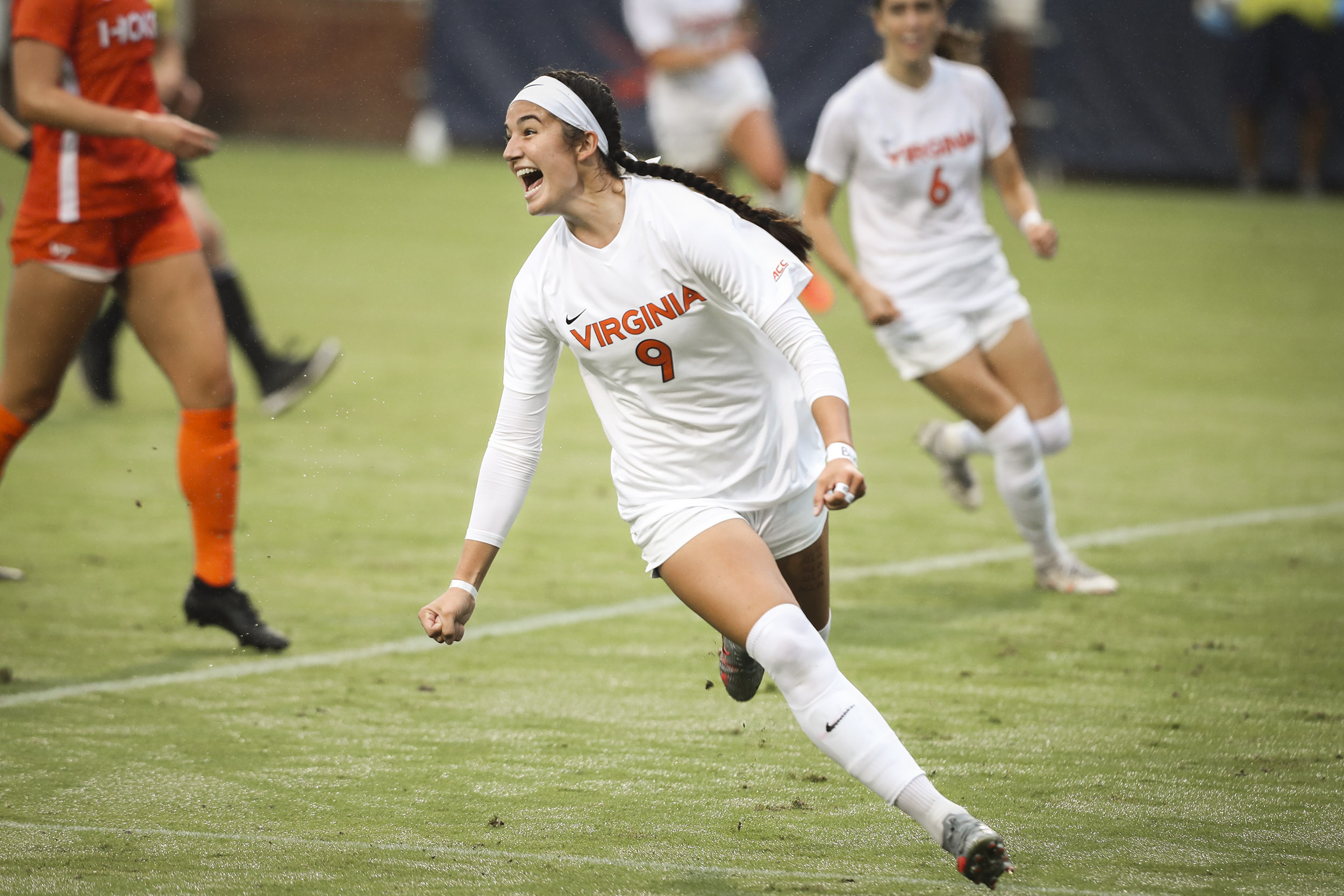 UVA Womens Soccer Playing running and screaming with joy
