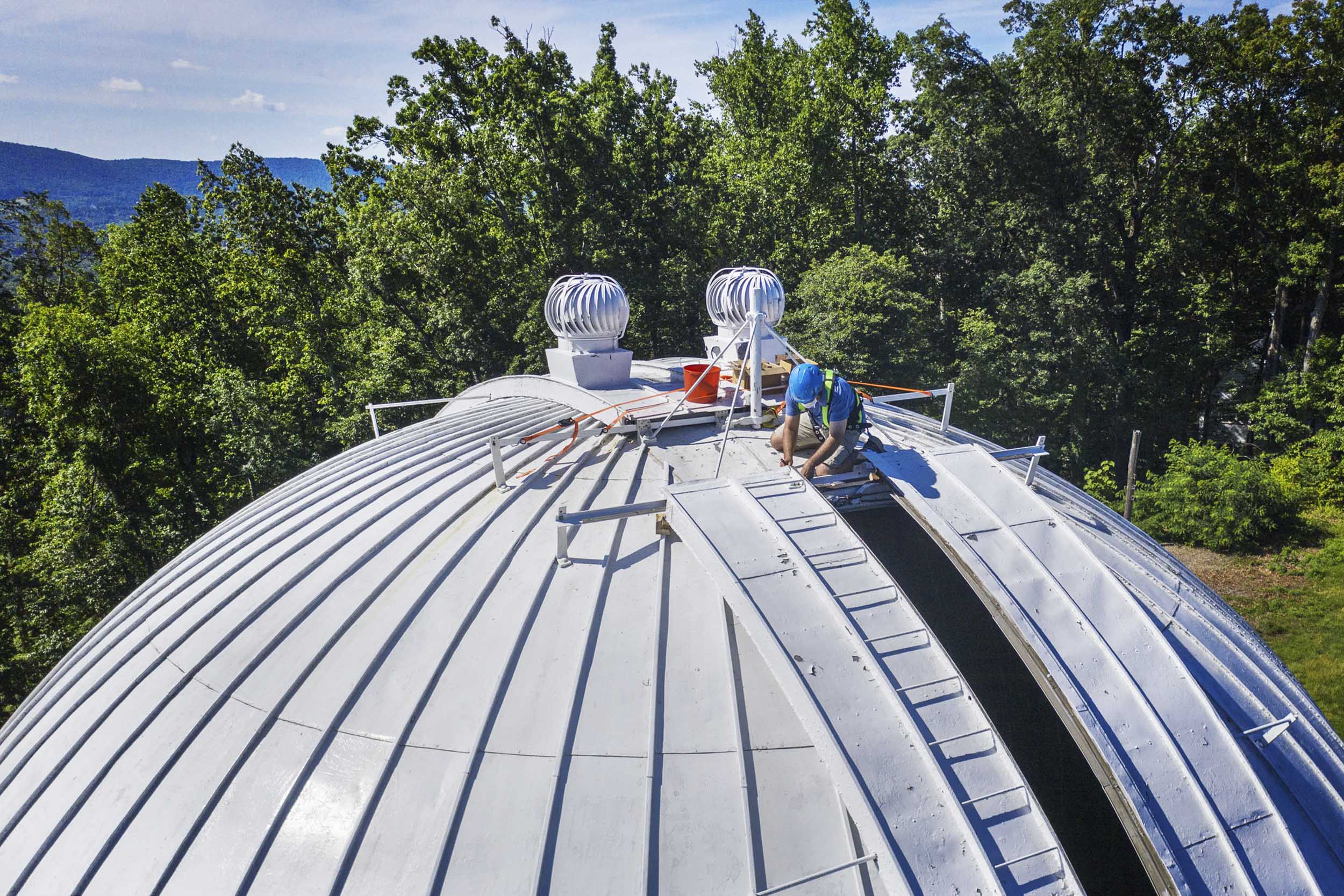 man working on the McCormick Observatory’s dome
